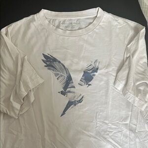 American Eagle Outfitters Cream Tee with Blue Graphic